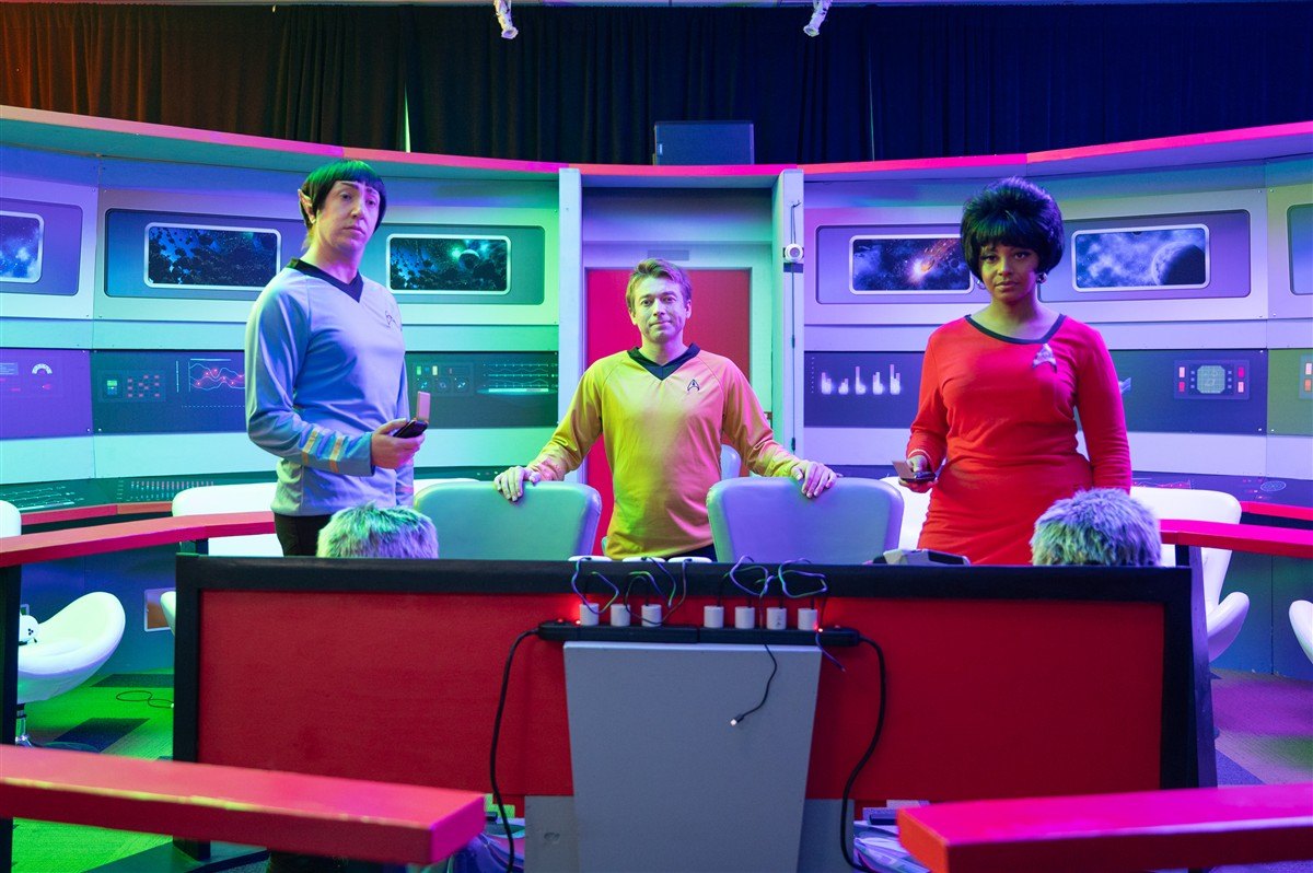 People participating on a colorful television-inspired set at Studio 37